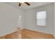 Bright bedroom featuring hardwood floors and a window, providing natural light at 127 S Perry St, Denver, CO 80219