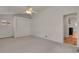 Bright bedroom featuring closet, ceiling fan, and neutral carpeting at 127 S Perry St, Denver, CO 80219