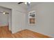 Bright bedroom with hardwood floors, closet, and a window providing natural light at 127 S Perry St, Denver, CO 80219