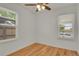 Cozy bedroom with hardwood floors, bright natural light, and white walls at 127 S Perry St, Denver, CO 80219