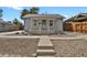 Charming single-story home features a covered porch, landscaped front yard, and inviting curb appeal at 127 S Perry St, Denver, CO 80219