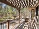 Inviting back deck with a wooden pergola, outdoor seating, and scenic views for relaxing or entertaining guests at 484 Hyland Dr, Castle Rock, CO 80108