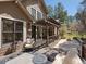 A charming outdoor patio includes a pergola and furnishings that are ideal for relaxing and entertaining at 484 Hyland Dr, Castle Rock, CO 80108