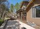 A backyard patio includes a wooden pergola, stone, and lush foliage, and provides an ideal outdoor space at 484 Hyland Dr, Castle Rock, CO 80108