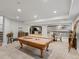 Finished basement with a pool table, bar and lounge area, perfect for entertaining at 484 Hyland Dr, Castle Rock, CO 80108