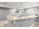 This basement bar features a stylish countertop, pendant lighting, and a sink for convenient entertaining at 484 Hyland Dr, Castle Rock, CO 80108
