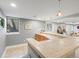 View of a basement bar with a tile countertop and stylish lighting adjacent to a window and another room at 484 Hyland Dr, Castle Rock, CO 80108