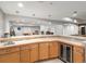 The basement bar includes ample counter space, a sink, wooden cabinetry, and a beverage cooler at 484 Hyland Dr, Castle Rock, CO 80108