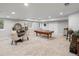 Spacious finished basement with a pool table, seating area, and neutral colors for a relaxing and versatile space at 484 Hyland Dr, Castle Rock, CO 80108