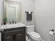 Clean powder room featuring a vanity with marble countertop, modern fixtures, and ample space at 484 Hyland Dr, Castle Rock, CO 80108