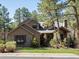 Charming home with stone accents, well-manicured lawn, and mature trees in a peaceful neighborhood at 484 Hyland Dr, Castle Rock, CO 80108