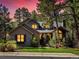 Charming home with stone accents, well-manicured lawn, and mature trees in a peaceful neighborhood at 484 Hyland Dr, Castle Rock, CO 80108