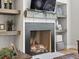 Stylish fireplace with wooden mantle and built-in shelves, offering a cozy focal point at 484 Hyland Dr, Castle Rock, CO 80108