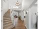 Elegant foyer featuring a grand staircase, hardwood floors, and soaring ceilings at 484 Hyland Dr, Castle Rock, CO 80108