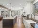 Bright open kitchen with a large island, stainless steel appliances, and hardwood floors at 484 Hyland Dr, Castle Rock, CO 80108