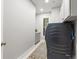 Bright laundry room featuring washer and dryer, with cabinets, granite countertop, and stylish runner at 484 Hyland Dr, Castle Rock, CO 80108