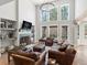 Spacious living room with fireplace, large windows, and comfortable seating at 484 Hyland Dr, Castle Rock, CO 80108