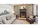 Cozy living room with rustic wood-paneled fireplace and natural light at 484 Hyland Dr, Castle Rock, CO 80108