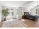 Bright main bedroom with hardwood floors, large windows, and ensuite bathroom with granite countertops at 484 Hyland Dr, Castle Rock, CO 80108