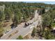 Welcoming neighborhood entrance featuring a charming guard house and landscaped surroundings at 484 Hyland Dr, Castle Rock, CO 80108