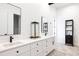 Elegant bathroom with double vanity and modern lighting at 26467 Bell Park Dr, Evergreen, CO 80439