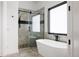 Spa-like bathroom with soaking tub and walk-in shower at 26467 Bell Park Dr, Evergreen, CO 80439