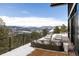 Deck with mountain views and outdoor seating at 26467 Bell Park Dr, Evergreen, CO 80439