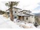 Stunning mountain home with snowy landscape and modern design at 26467 Bell Park Dr, Evergreen, CO 80439