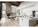 Modern kitchen with white cabinetry, large island, and mountain views at 26467 Bell Park Dr, Evergreen, CO 80439