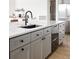 Modern kitchen island with sink and dishwasher at 26467 Bell Park Dr, Evergreen, CO 80439