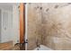 Beige tiled bathroom with shower/tub combo at 4600 E Asbury Cir # 202, Denver, CO 80222