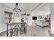 Bright dining area with a table and four stools at 4360 E 70Th Ct, Commerce City, CO 80022