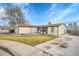 Ranch style home with attached garage and a deck at 4360 E 70Th Ct, Commerce City, CO 80022