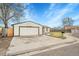 Front view of a ranch style home with a basketball hoop at 4360 E 70Th Ct, Commerce City, CO 80022