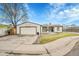 Ranch style home with attached garage, deck, and landscaped yard at 4360 E 70Th Ct, Commerce City, CO 80022