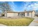 House exterior with a deck and a nicely landscaped yard at 4360 E 70Th Ct, Commerce City, CO 80022