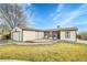 House exterior showcasing a deck and well-maintained lawn at 4360 E 70Th Ct, Commerce City, CO 80022