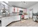 Well-equipped kitchen featuring white cabinets and granite countertops at 4360 E 70Th Ct, Commerce City, CO 80022