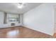 Bright bedroom with hardwood floors, a large window, and plenty of natural light at 755 S Alton Way # 9D, Denver, CO 80247