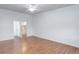 Spacious bedroom with wood floors, ceiling fan, and closet at 755 S Alton Way # 9D, Denver, CO 80247