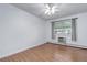 Bedroom with wood flooring, ceiling fan, and window overlooking neighborhood at 755 S Alton Way # 9D, Denver, CO 80247