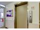 Building elevator offering accessibility to all units with posted stairway signage visible on the wall at 755 S Alton Way # 9D, Denver, CO 80247