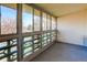 This condo boasts an enclosed balcony with large windows offering plentiful natural light and views of the neighborhood at 755 S Alton Way # 9D, Denver, CO 80247