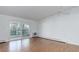 Spacious living room with hardwood floors and sliding glass doors to a private balcony at 755 S Alton Way # 9D, Denver, CO 80247