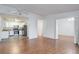 Open concept living room, adjacent to kitchen, with hardwood floors and natural light at 755 S Alton Way # 9D, Denver, CO 80247