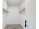 Walk-in closet with carpet floors and shelves at 755 S Alton Way # 9D, Denver, CO 80247