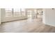 Bright and airy living room featuring hardwood floors, large windows, and sliding door access to the backyard at 11052 Snowdon St, Parker, CO 80134