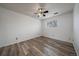 Cozy bedroom with wood-style floors, a ceiling fan, and a window for natural light at 16259 W 10Th Ave # A4, Golden, CO 80401