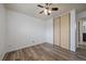 Bedroom features wood floors, ceiling fan, closet, and neutral walls at 16259 W 10Th Ave # A4, Golden, CO 80401