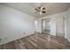 A well-lit bedroom with wood floors, ceiling fan, closet, and neutral walls at 16259 W 10Th Ave # A4, Golden, CO 80401